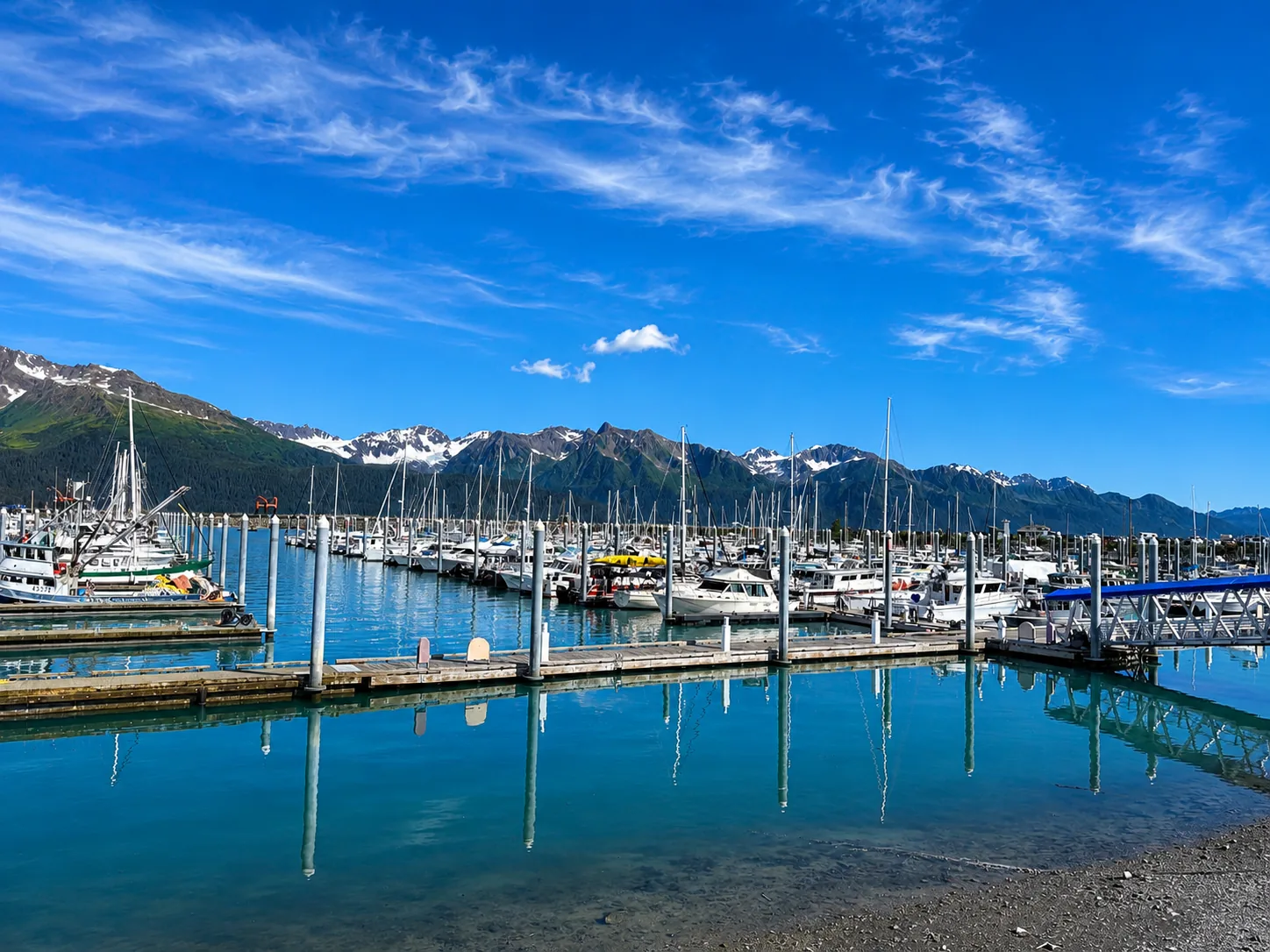 Seward harbor with mountains reflected in the water